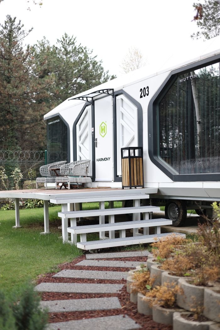 The Art of Drawing Readers In: Your attractive post title goes here Sleek modular home with modern design in a serene outdoor setting, ideal for tranquility.